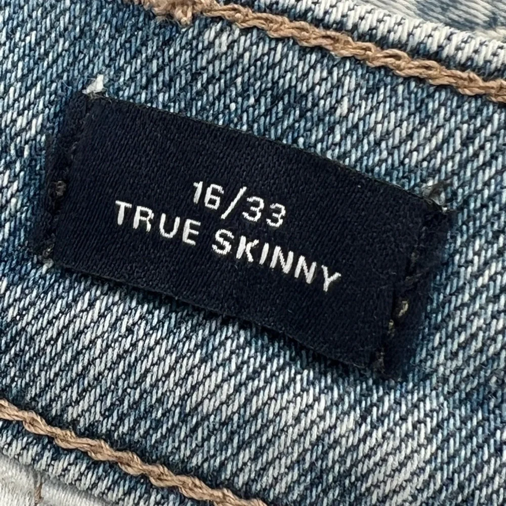 GAP 1969‎ distressed light-wash skinny ripped jeans